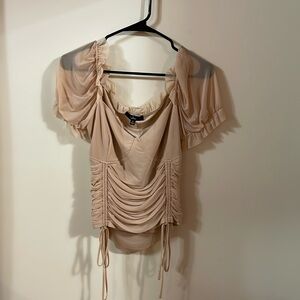 Pink colored blouse with sheer sleeves